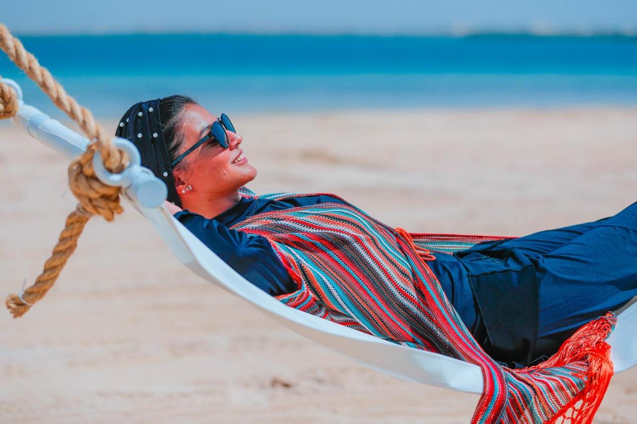 Bay La Sun Hotel&Marina - KAEC King Abdullah Economic City Bagian luar foto A woman relaxing in a hammock